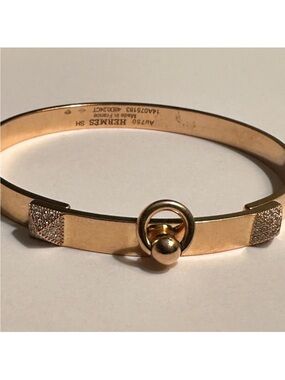 Hermes Gold Tone Bangle Bracelet with Ring Detail